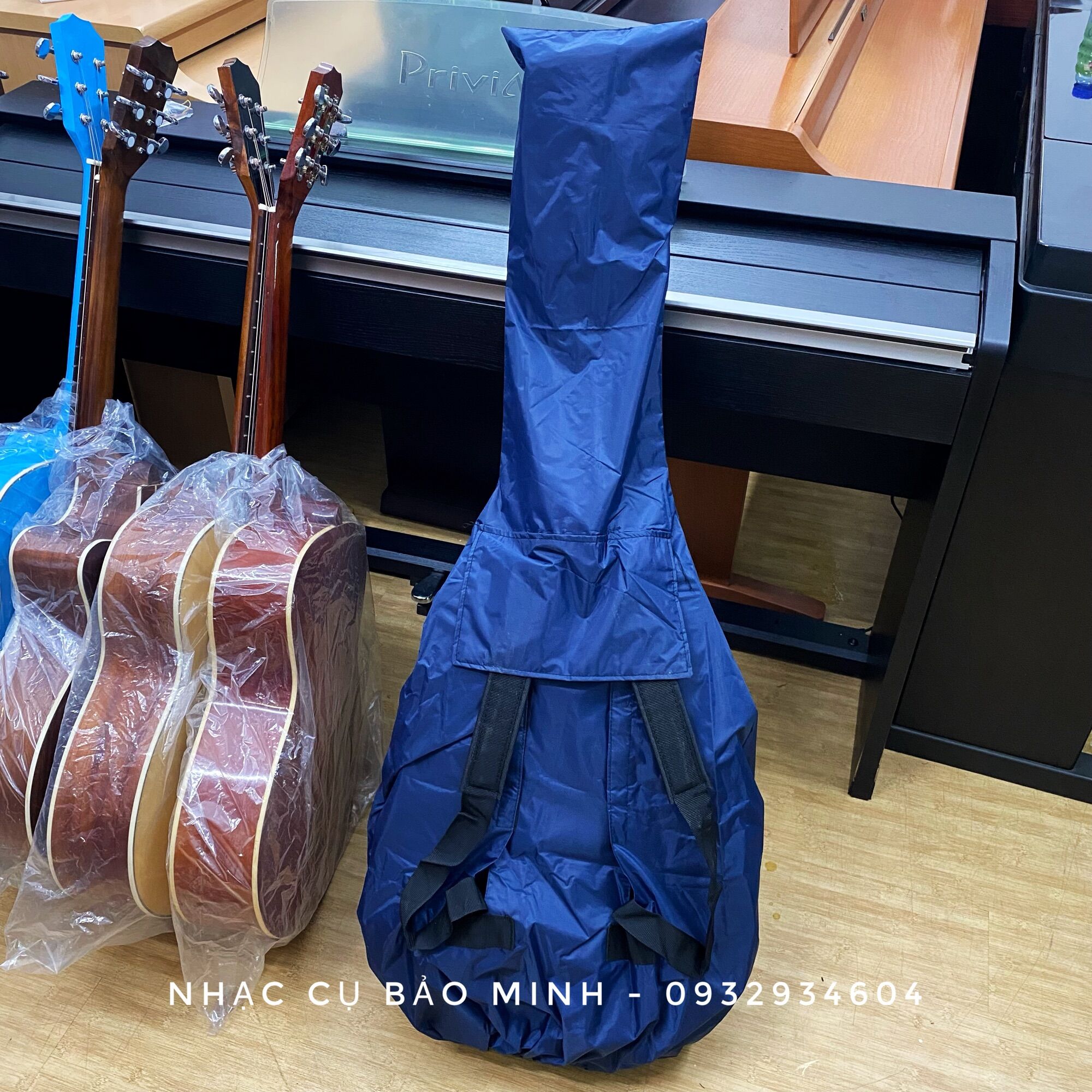 Bao áo mưa đàn guitar, bảo vệ đàn guitar chống mưa bão loại tốt