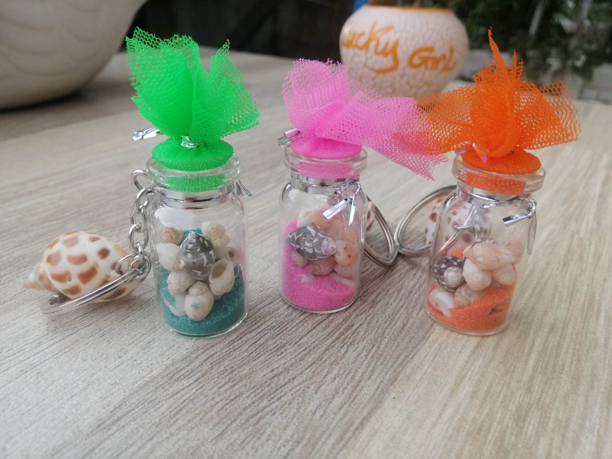 MÓC KHÓA CHAI THỦY TINH ĐỰNG ỐC SIZE 2*4 CM