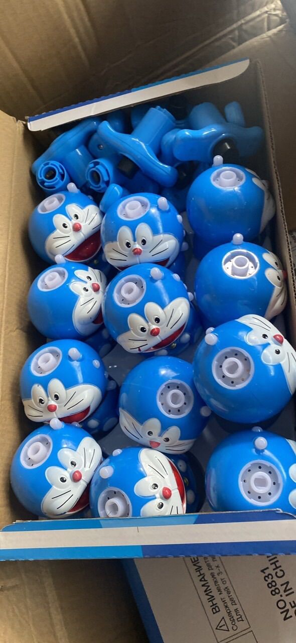 Đồ chơi bông vụ, con quay doraemon có đèn và nhạc cho bé