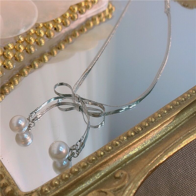 Choker titan dây mảnh  nơ ngọc (zl)(màu trắng)