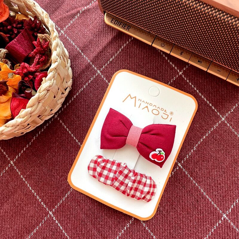 Set kẹp tóc màu đỏ lễ Tết cho bé gái