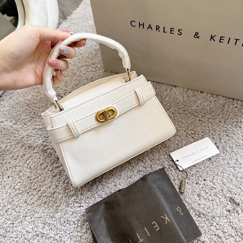 Túi quai cầm & đeo chéo khoá dây dạng xoay size 19