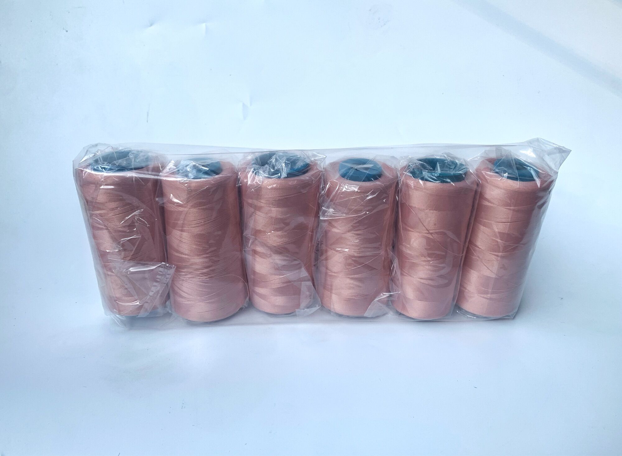 Vỉ 6 cuộn chỉ tơ vắt sổ màu hồng đất 5000m