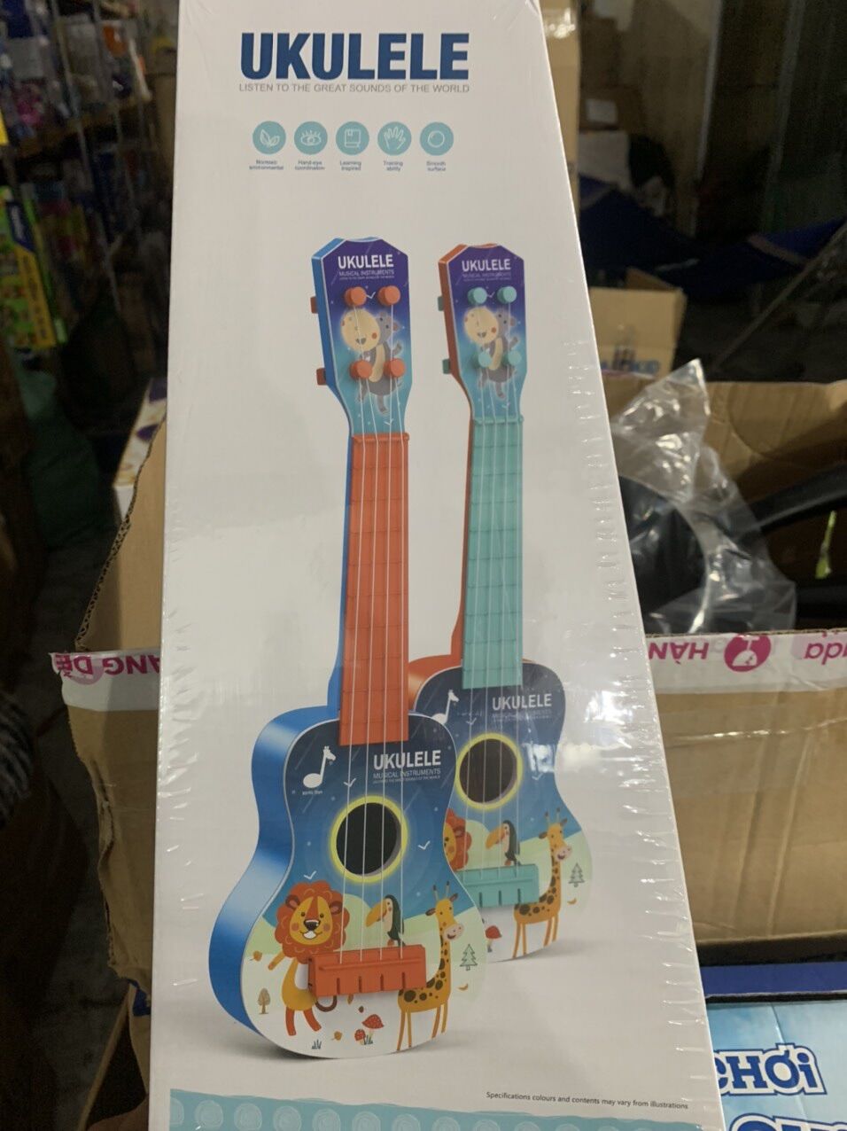 —- Đồ chơi đàn Ukulele- hkm tã