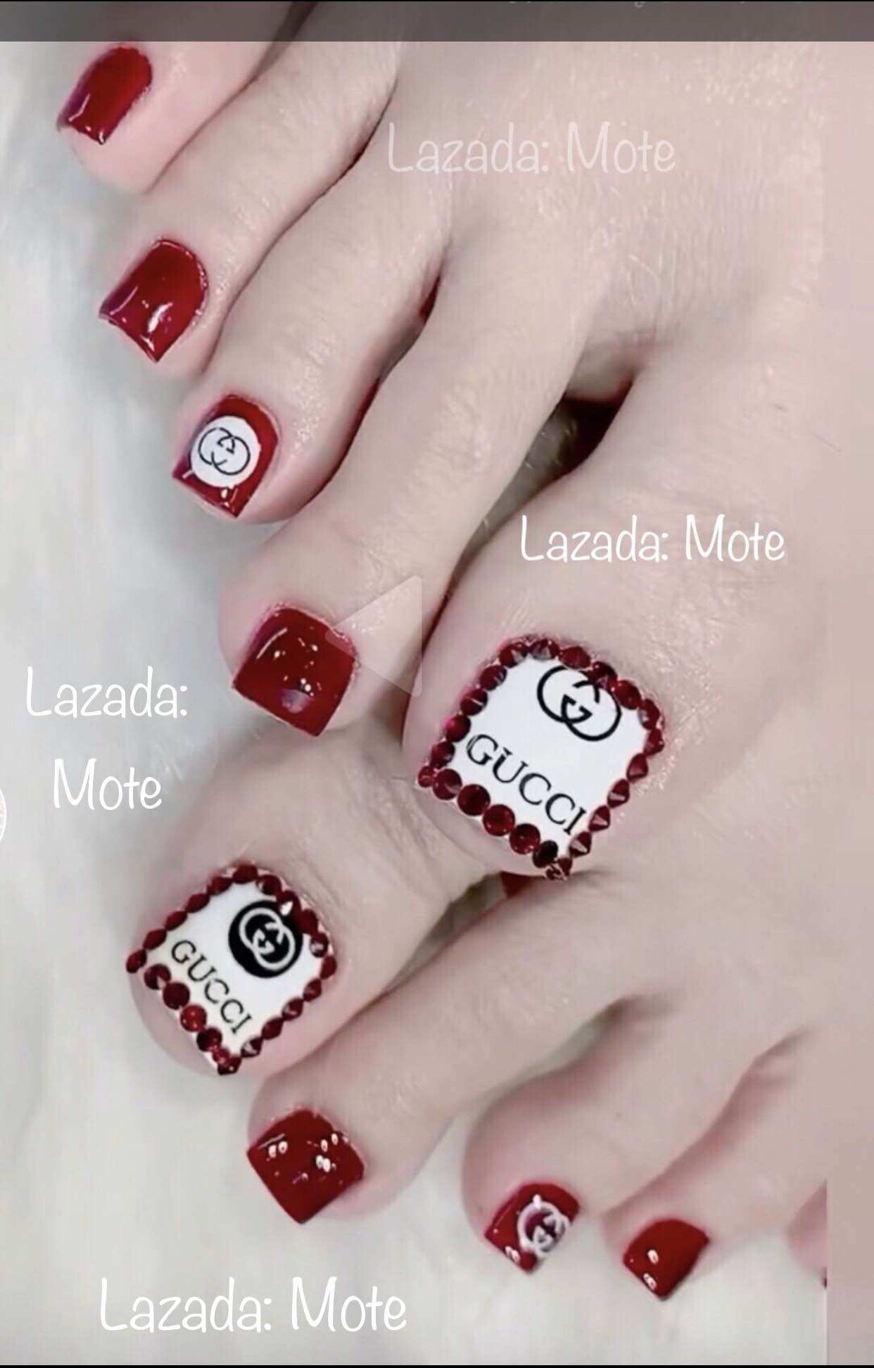 Móng chân úp nail thiết kế đỏ đô phối đá