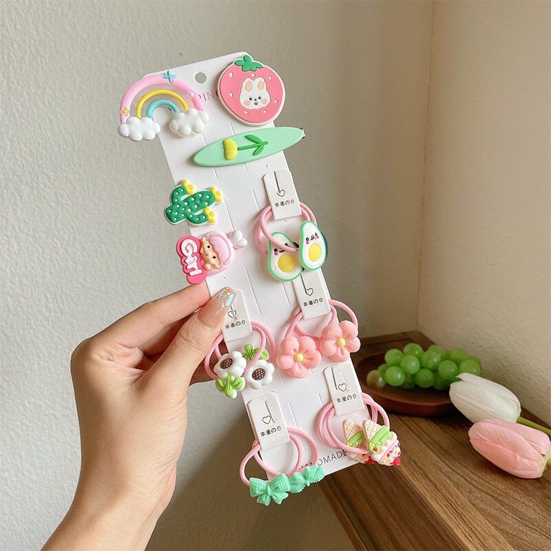 Vỉ 15 buộc tóc kèm cột tóc cho bé