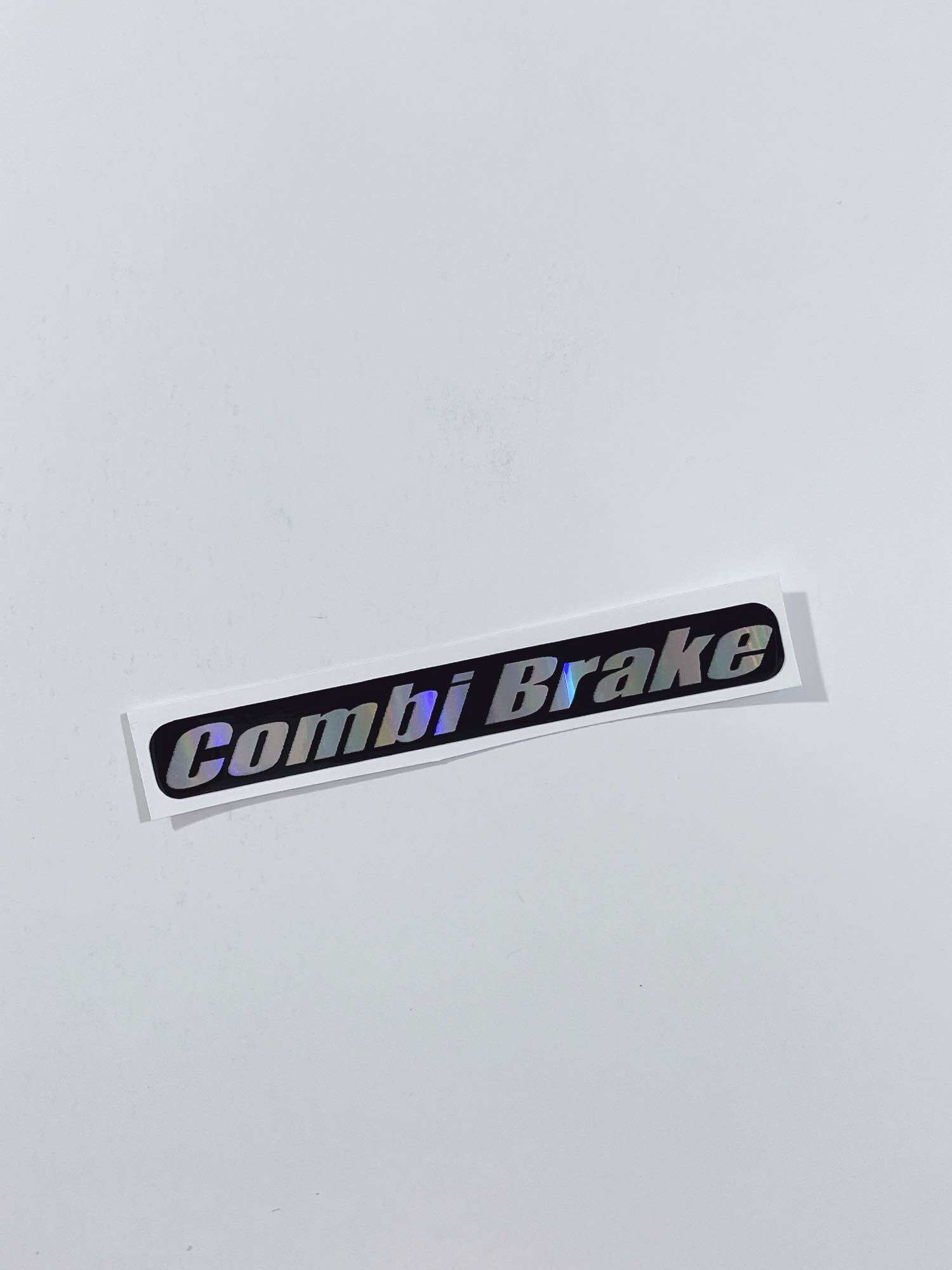 Tem chữ Combi Brake 8.2x1.1cm dán dè trước xe tay ga, tem có sẵn keo
