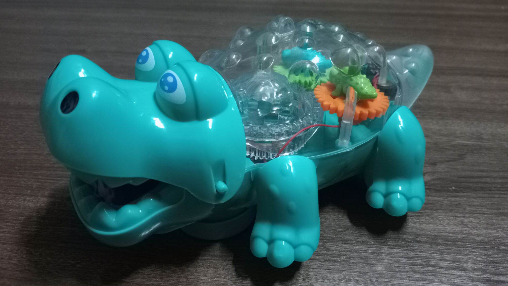 Đồ chơi con cá sấu bò có nhạc và đèn cho bé