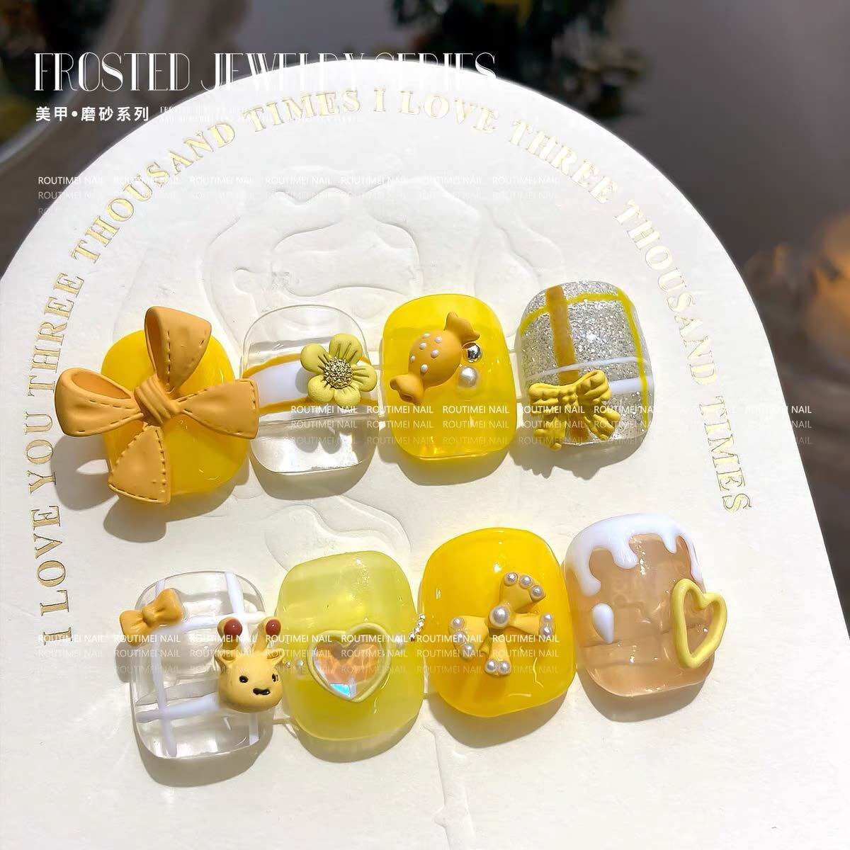 Charm nơ vàng set 15 viên m703