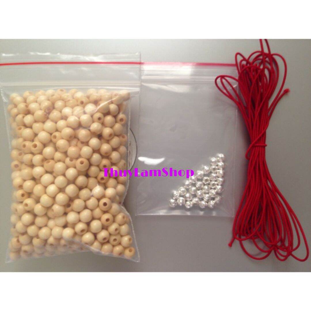 100 hạt dâu tằm việt nam + 10 bi bạc + 2m dây thun đỏ + 1 kim xâu vòng