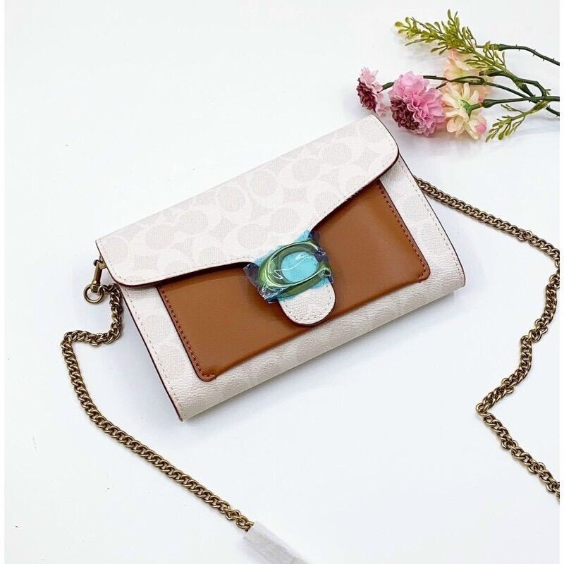 Túi đeo chéo kiêm clutch C0 ach tabby