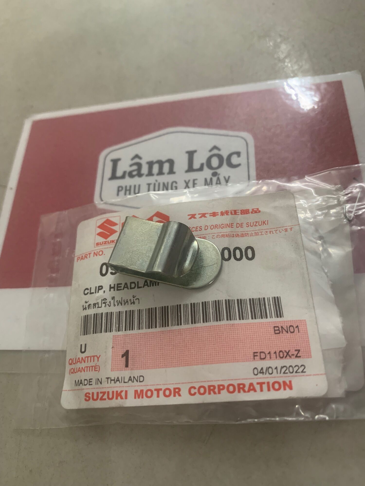 Phe kẹp pha đèn suzuki chính hãng