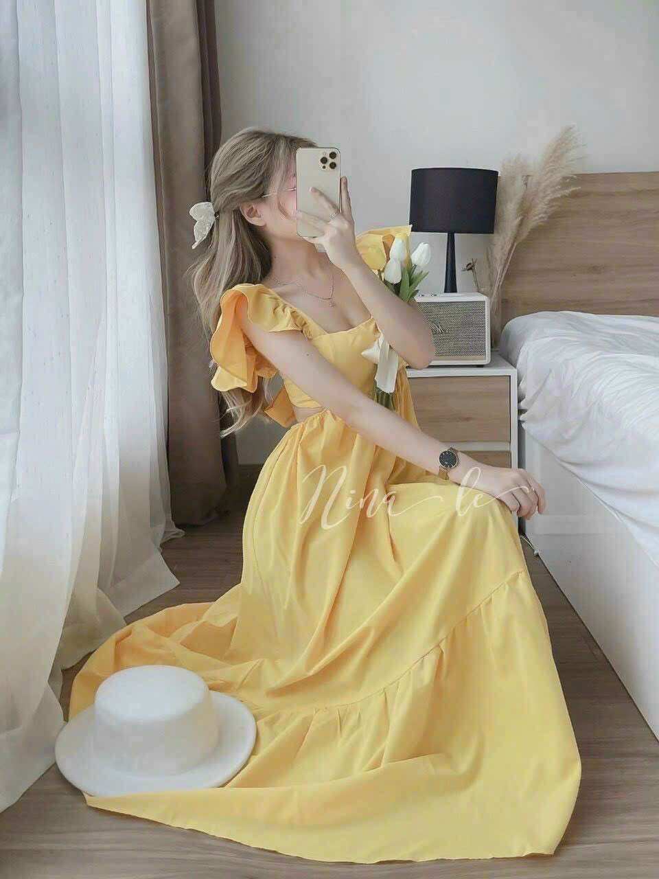 Đầm maxi khoét eo dây cột nơ lưng trẻ trung