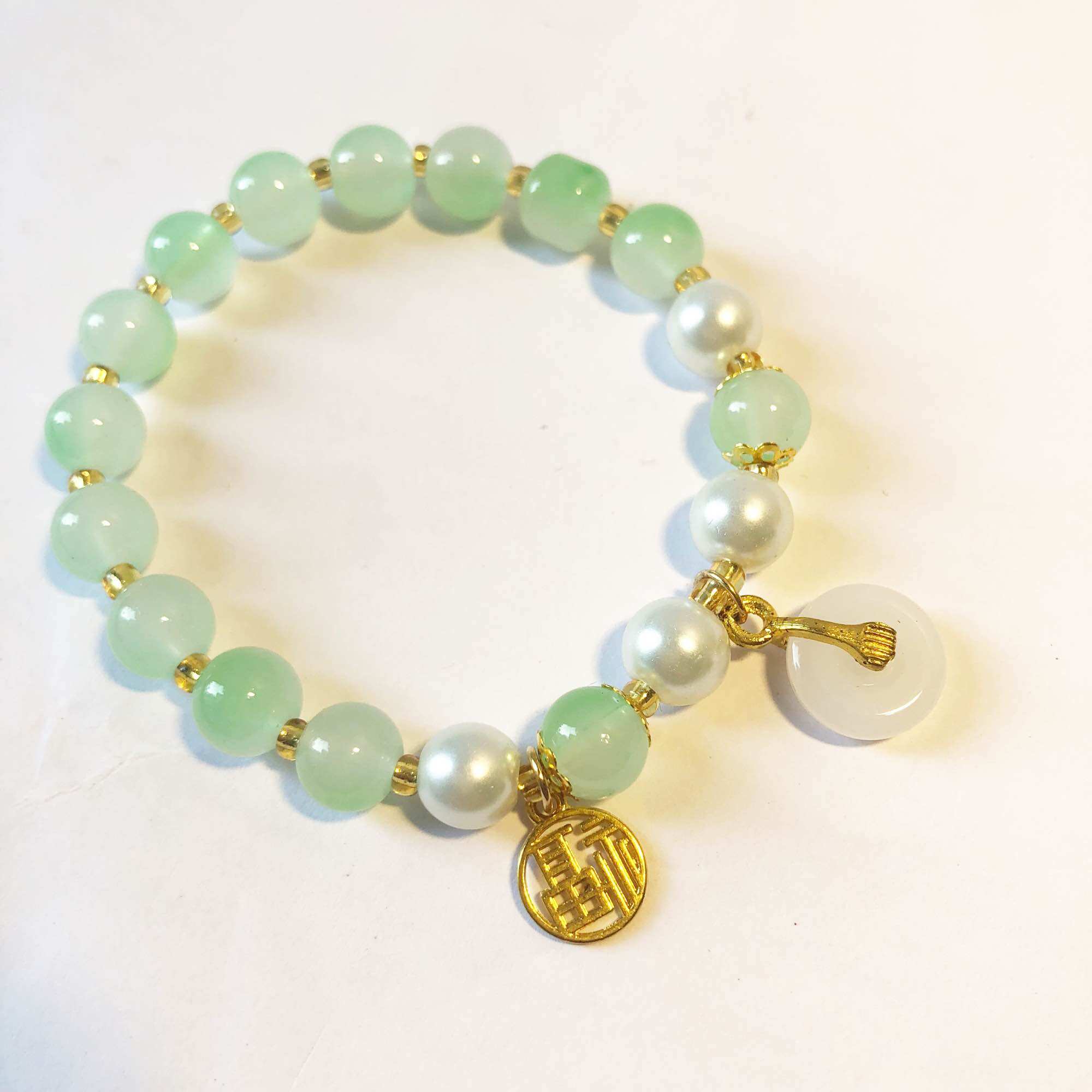 Chuỗi vòng tay đá charm xu may mắn