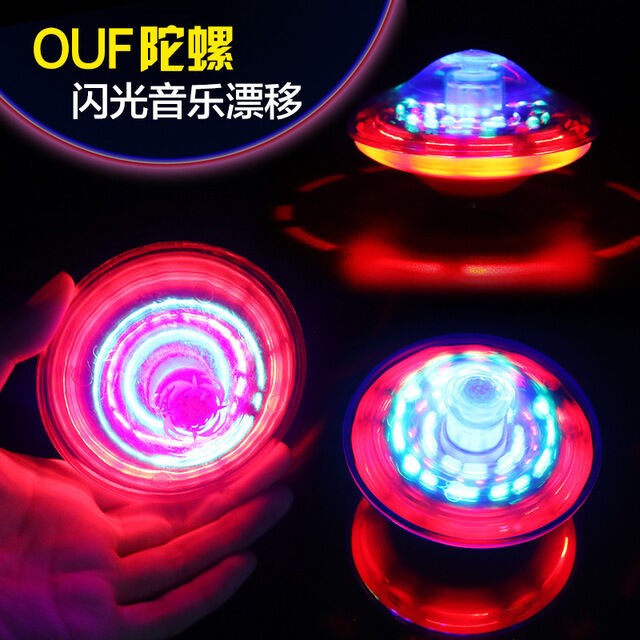 Con quay âm nhạc ufo đầy màu sắc con quay con quay kiểu đứng phát sáng cho trẻ em con quay xoay tự động phát sáng bằng điện đồ chơi chợ đêm