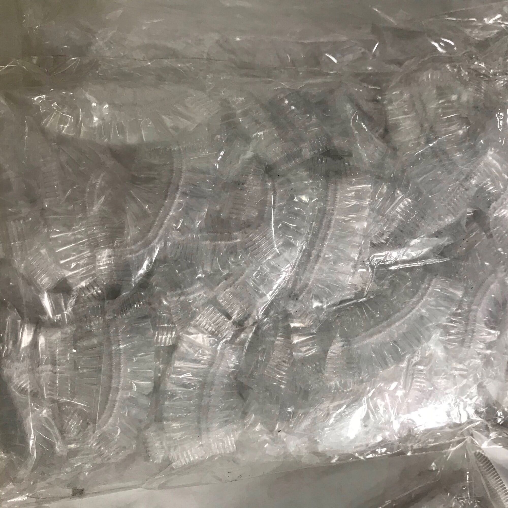 Bao trùm tai nilon khi uốn nhuộm (gói 100 chiếc)