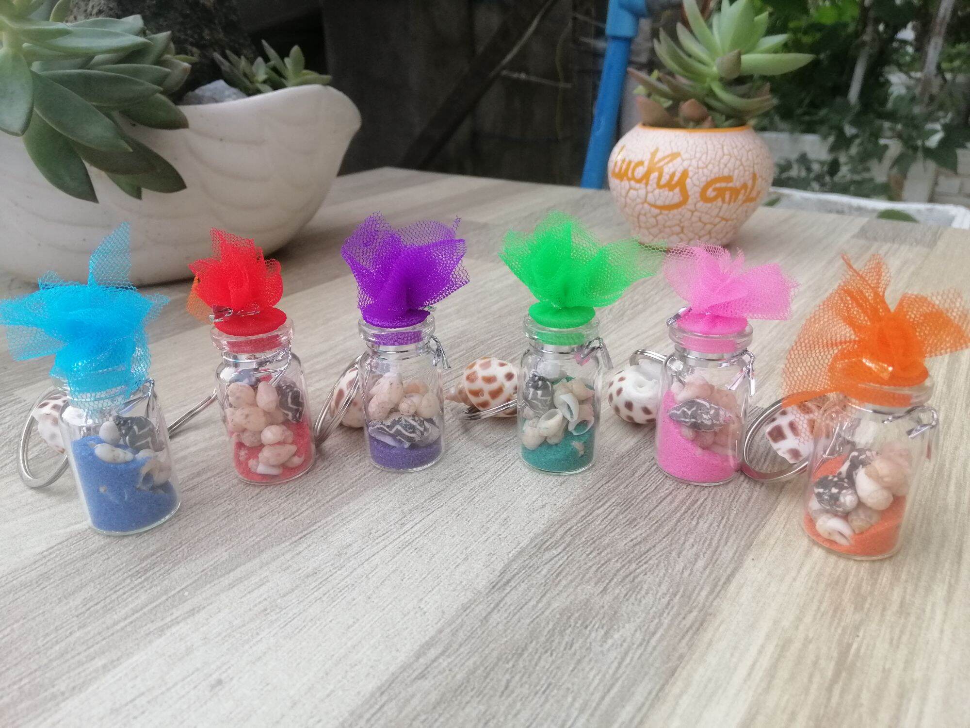 MÓC KHÓA CHAI THỦY TINH ĐỰNG ỐC SIZE 2*4 CM