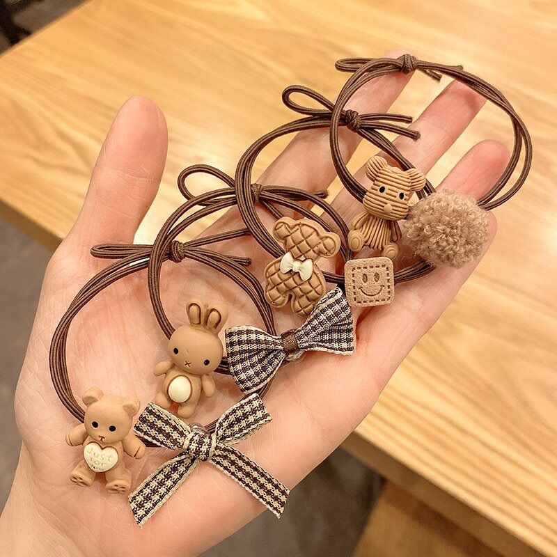 Buộc tóc gấu nâu phối nơ