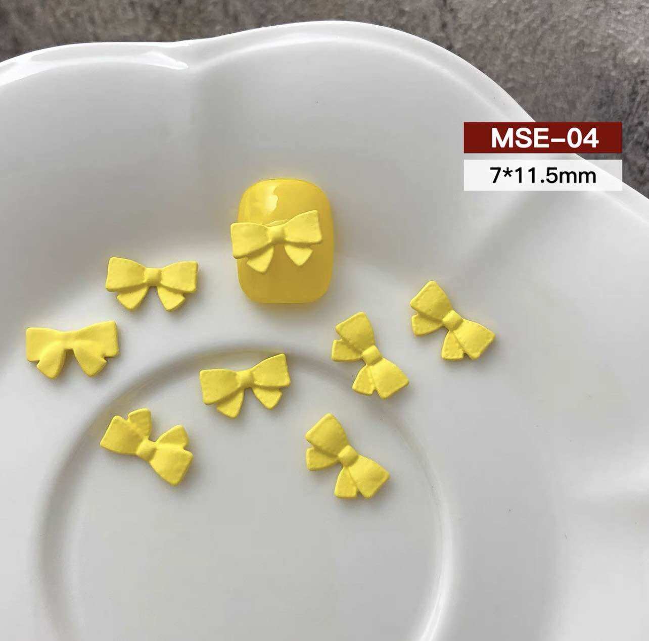 CHARM NƠ VÀNG SET 15 VIÊN M703