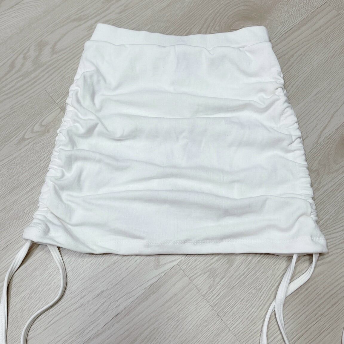 CHÂN VÁY NGẮN ÔM KIỂU RÚT DÂY FORM 50KG(U)