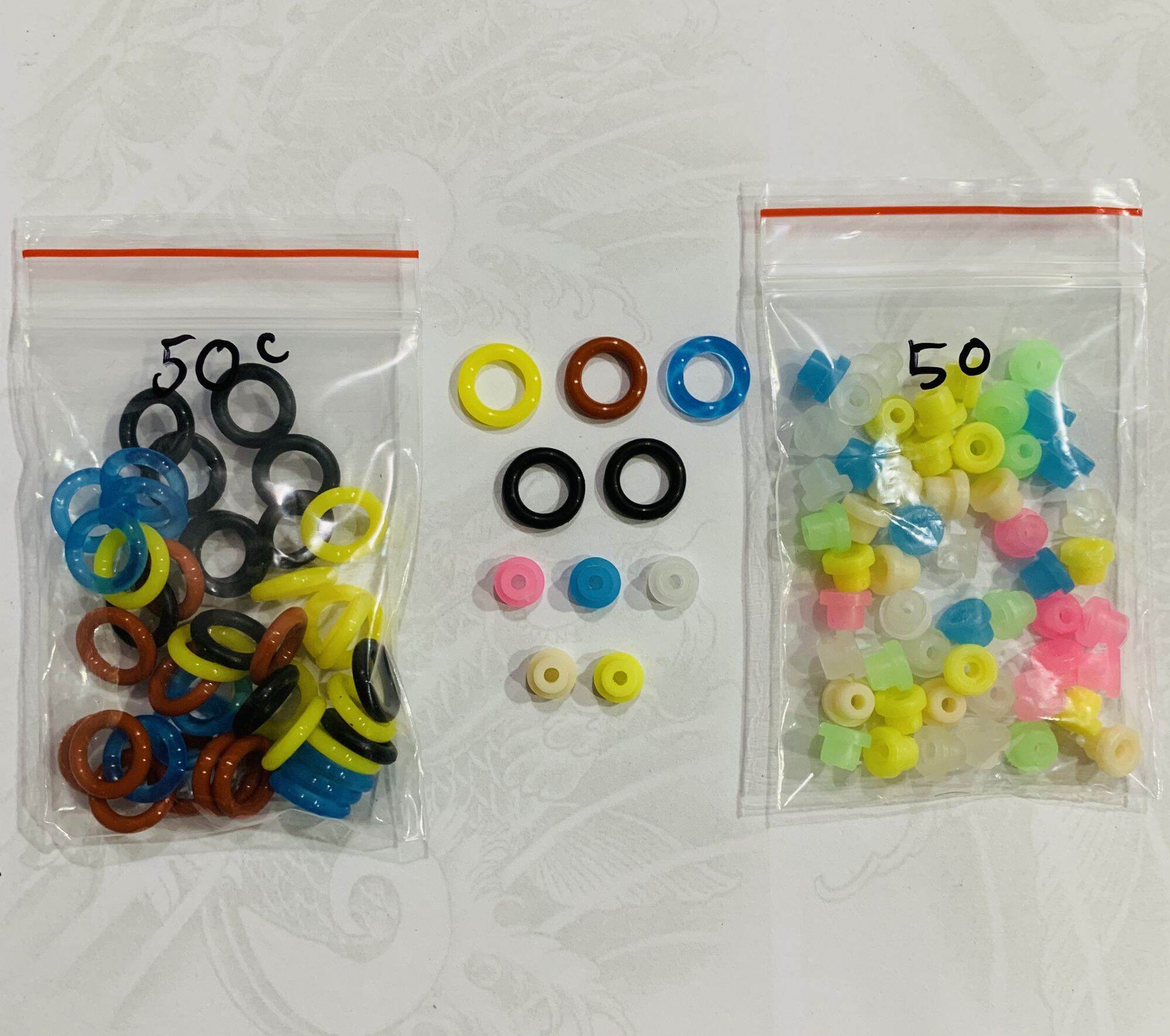 50 vòng đàn hồi + 50 núm giữ kim của máy xăm