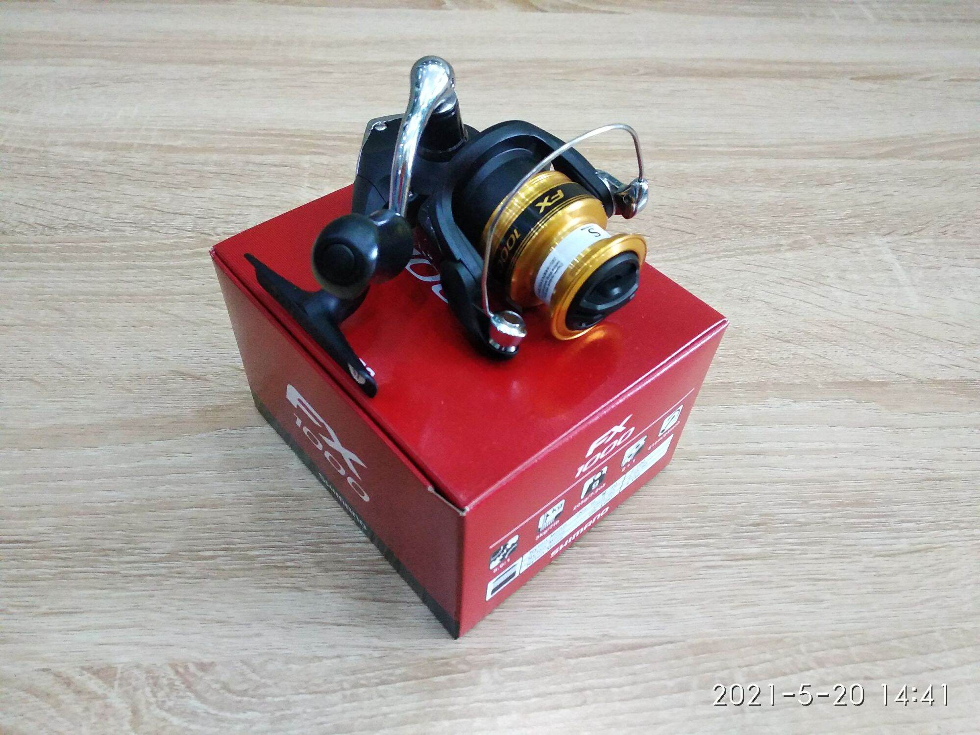 Máy câu cá shimano 2019 fx 1000 - máy đứng