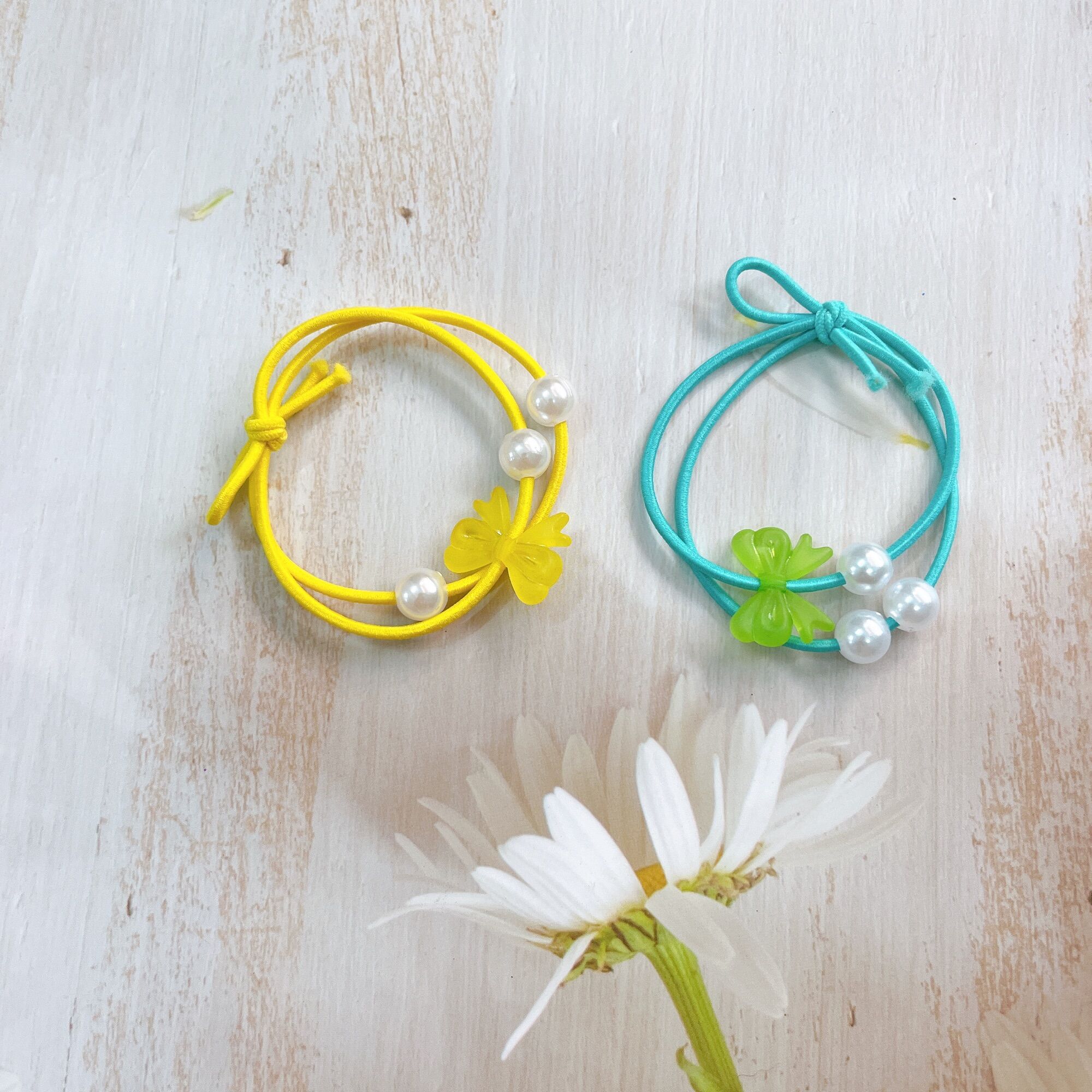 Set 100 dây cột tóc nơ ngọc 3 hạt trai giá rẻ