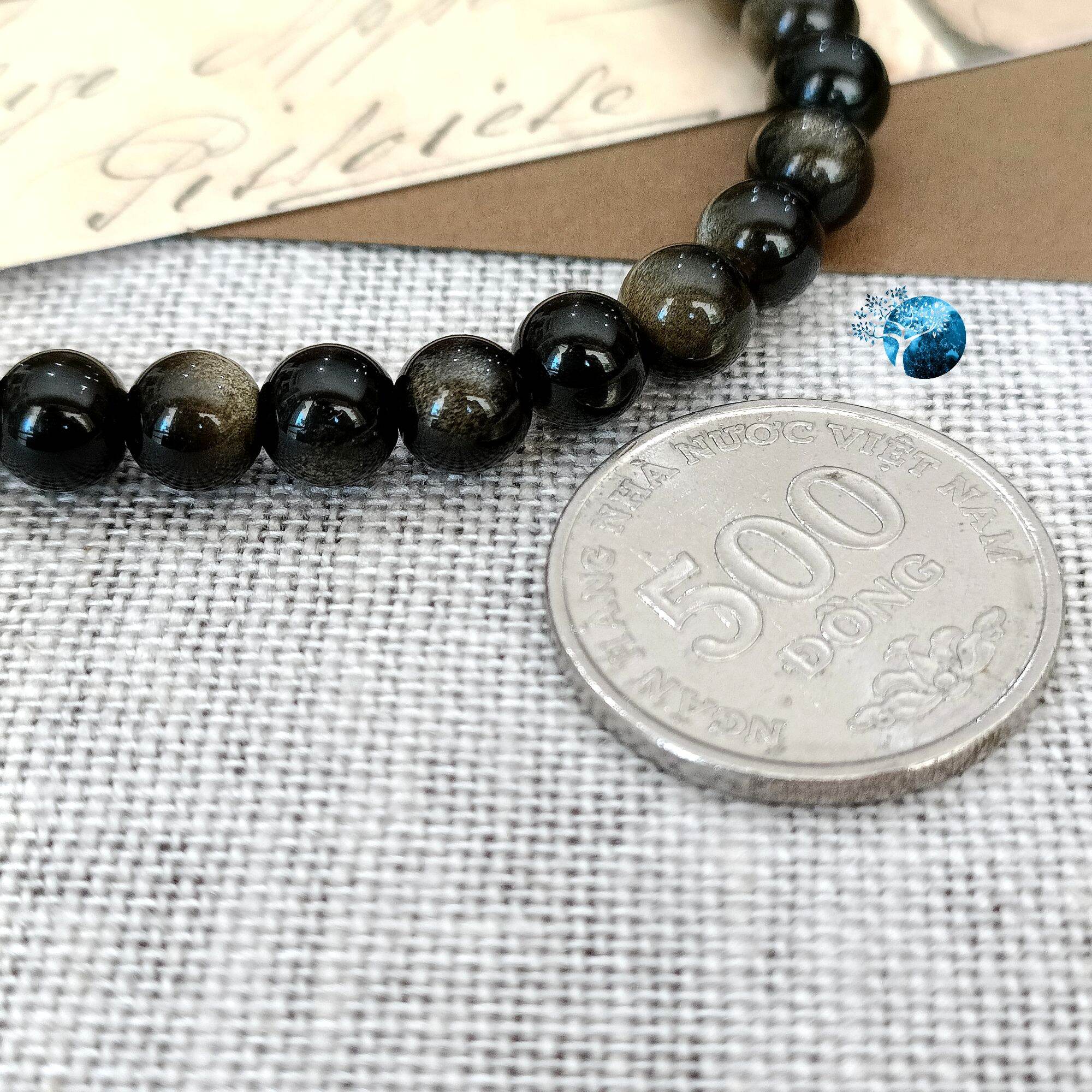 Vòng tay đá obsidian ánh vàng nâu 6mm