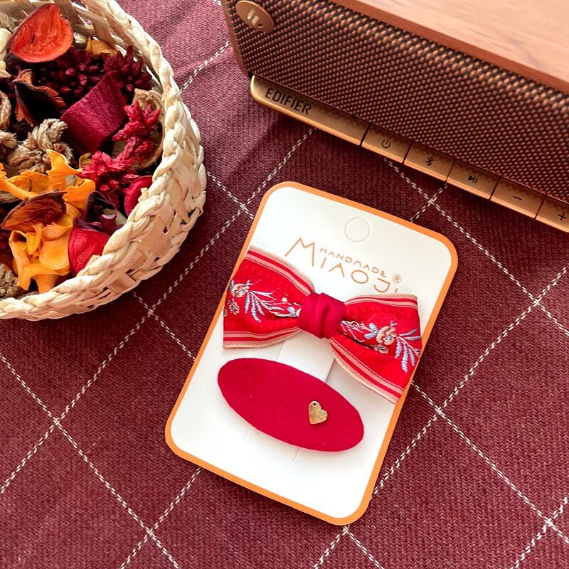 Set kẹp tóc màu đỏ lễ Tết cho bé gái