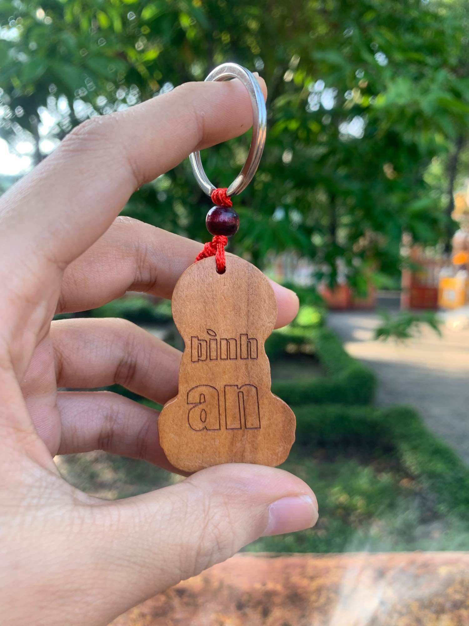 Móc khoá gỗ phật bà quan âm bình an size 5 cm