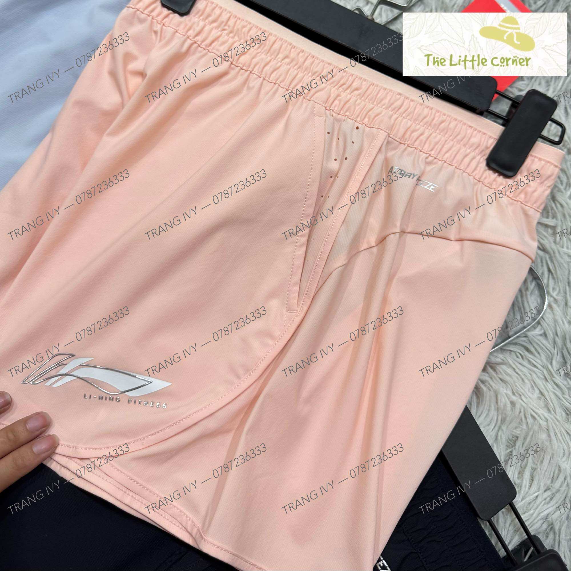 Quần short gió nữ Lining AKST754