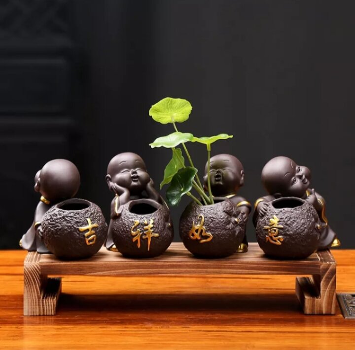 Tượng chú tiểu cầu phúc . tượng chú tiểu trồng cây