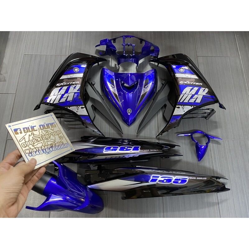 Áo Ex 135 xanh đen tạng tem candy