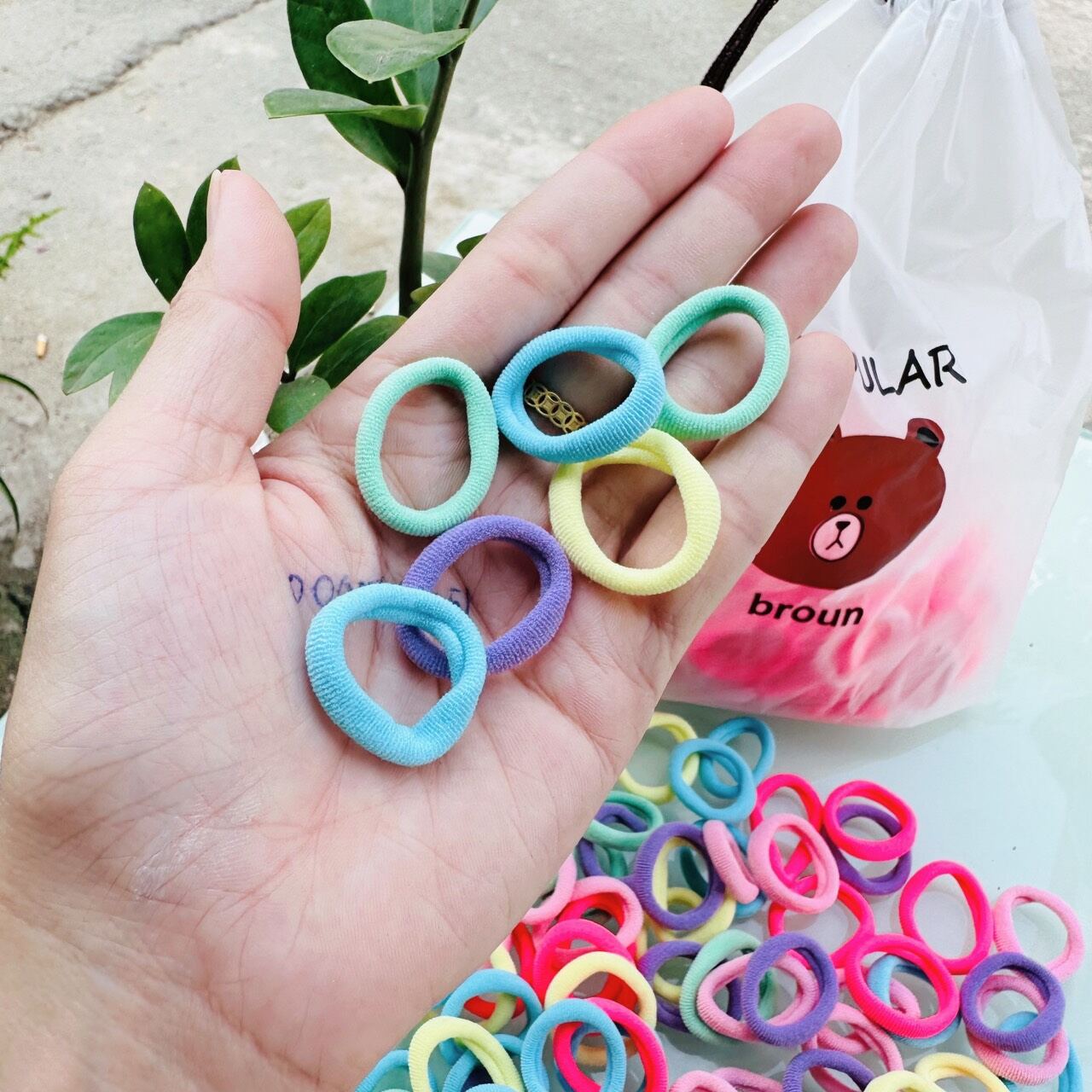 túi 100 dây cột tóc ( màu ngẩu nhiên)