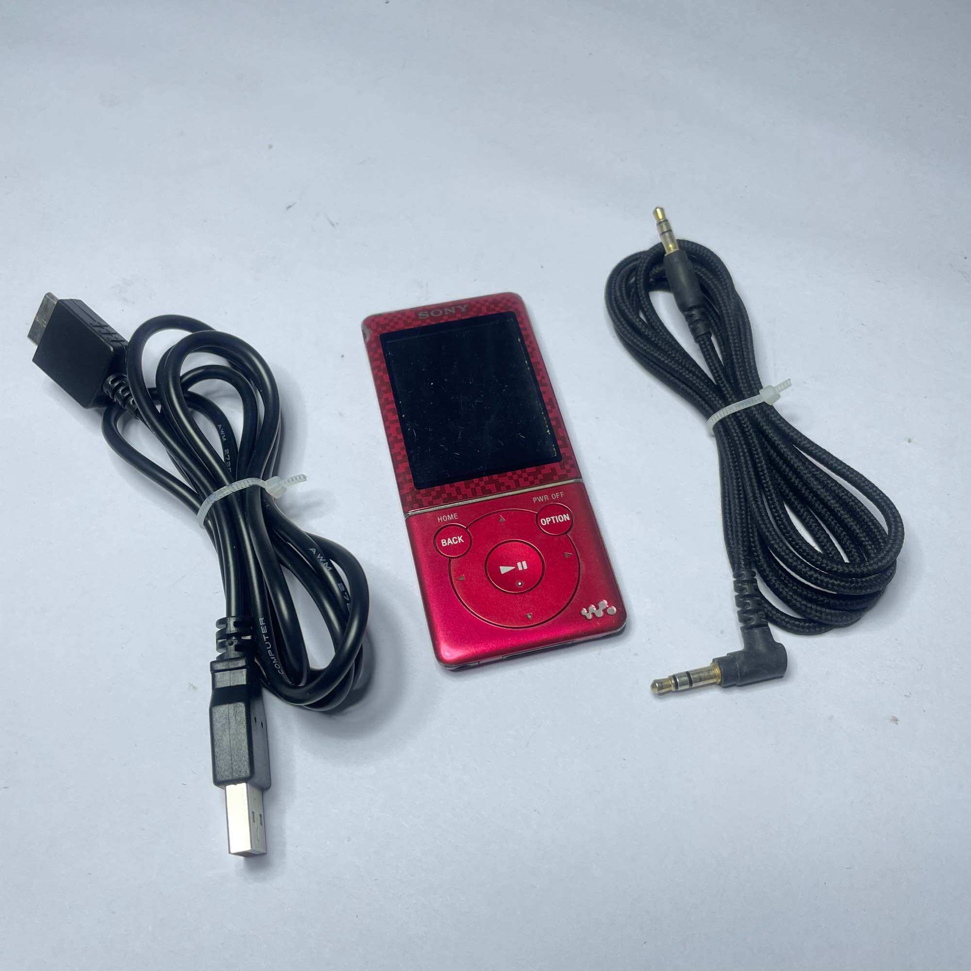 Máy nghe nhạc Sony NWZ-E474 cũ lỗi pin phím Hold và Vol,còn dùng được bằng nguồn trực tiếp,tặng kèm phụ kiện như hình