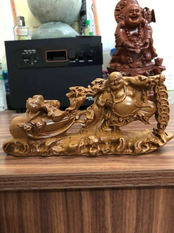 Tượng gỗ để xe ô tô phong thủy mẫu kéo bao gỗ bách xanh