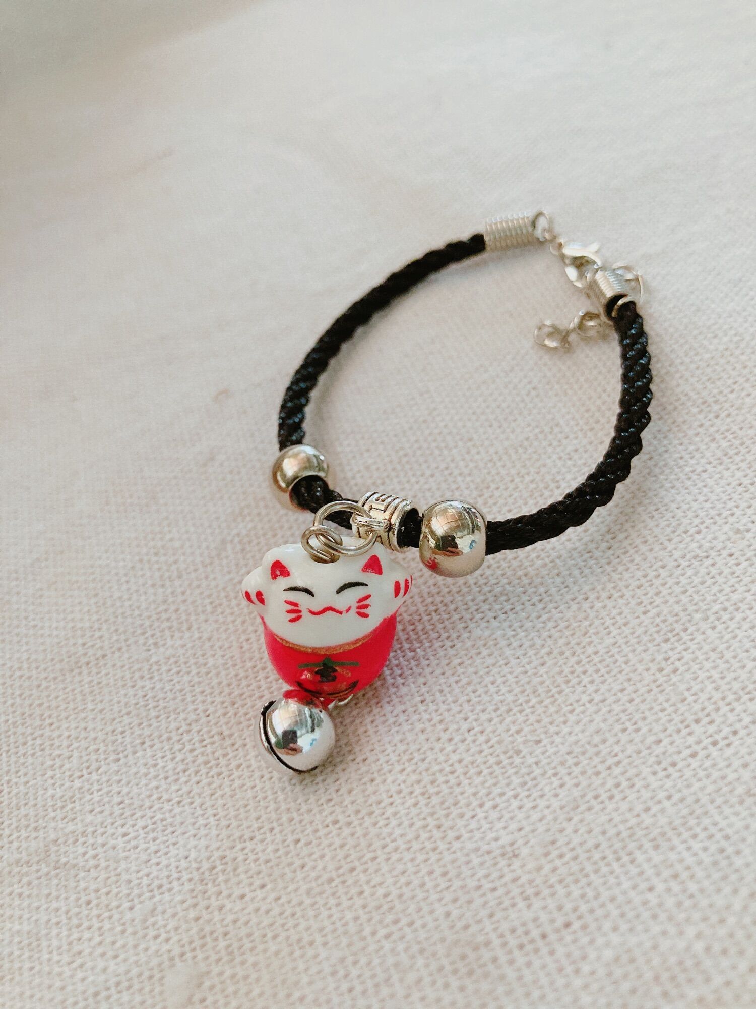 Vòng tay mèo maneki neko gốm sứ