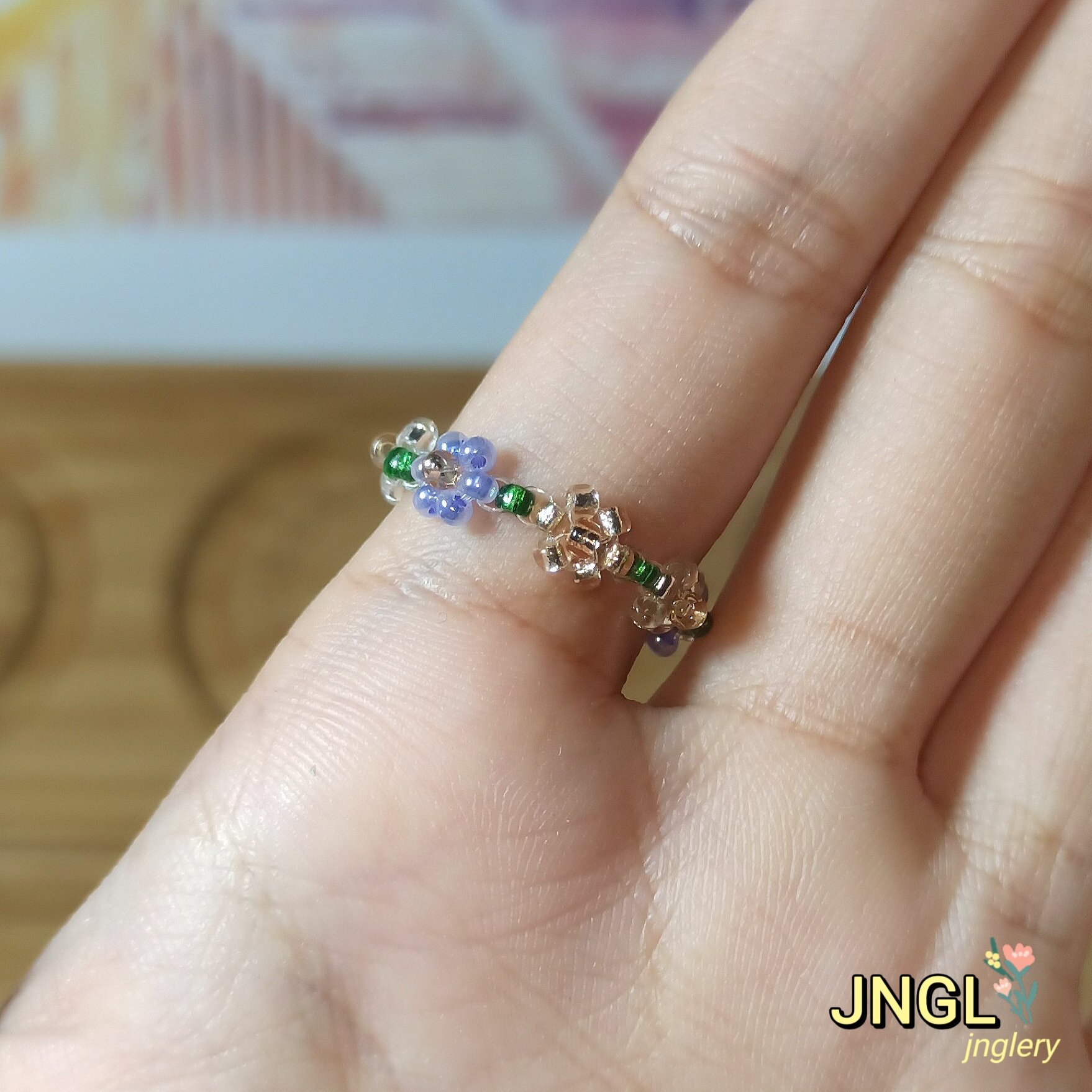 Nhẫn hoa hạt cườm nơ thỏ