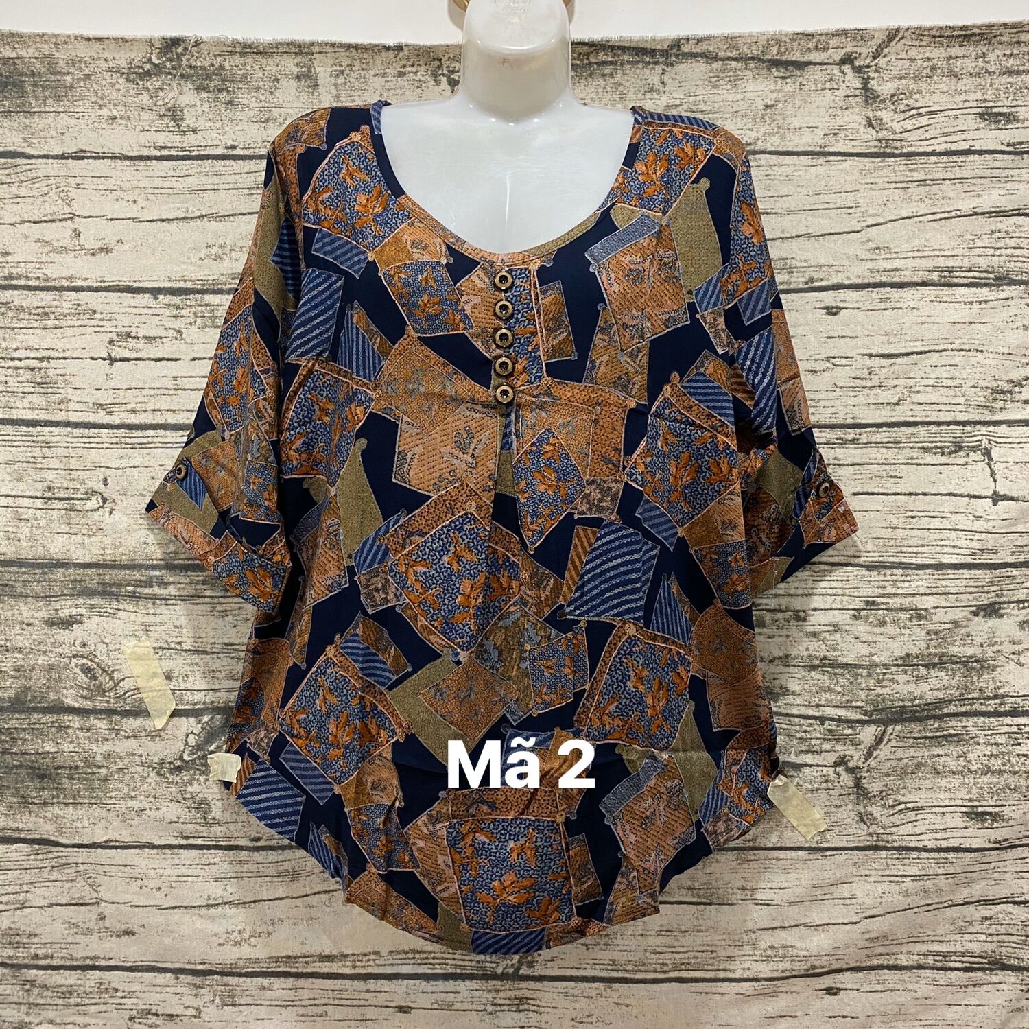 Áo cổ tròn nút trung niên vải tonl