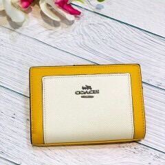 Ví cầm tay mini da thật Coach