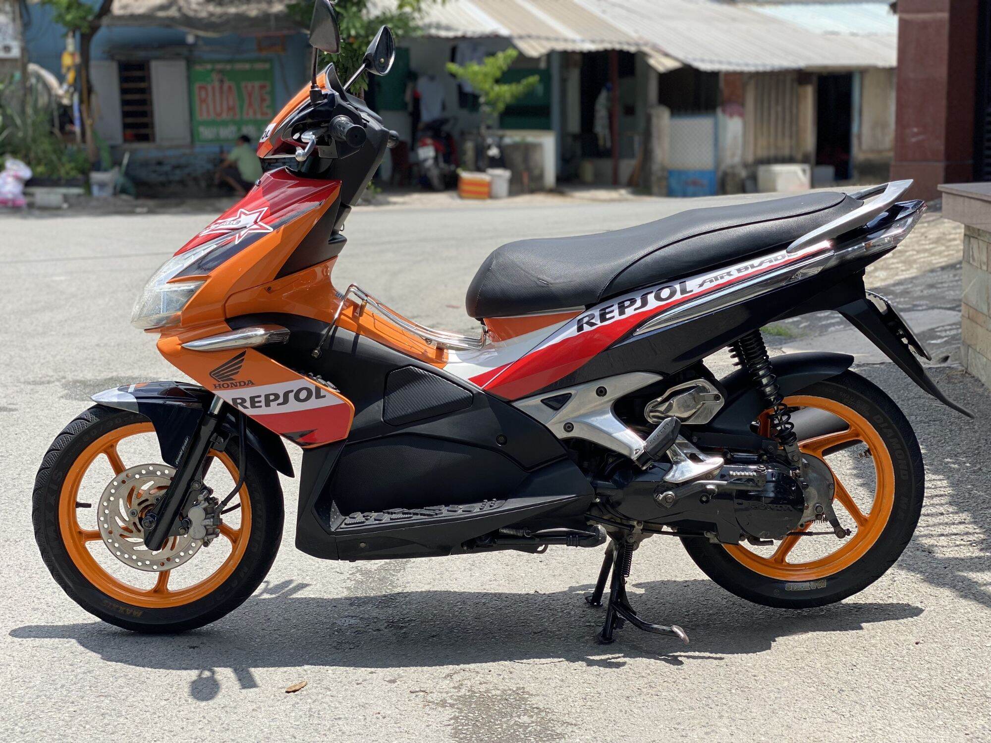 Tem xe Air Blade 2009 - Mẫu tem rời Repsol dán xe cam đen - Tem rời 3 lớp không bay màu