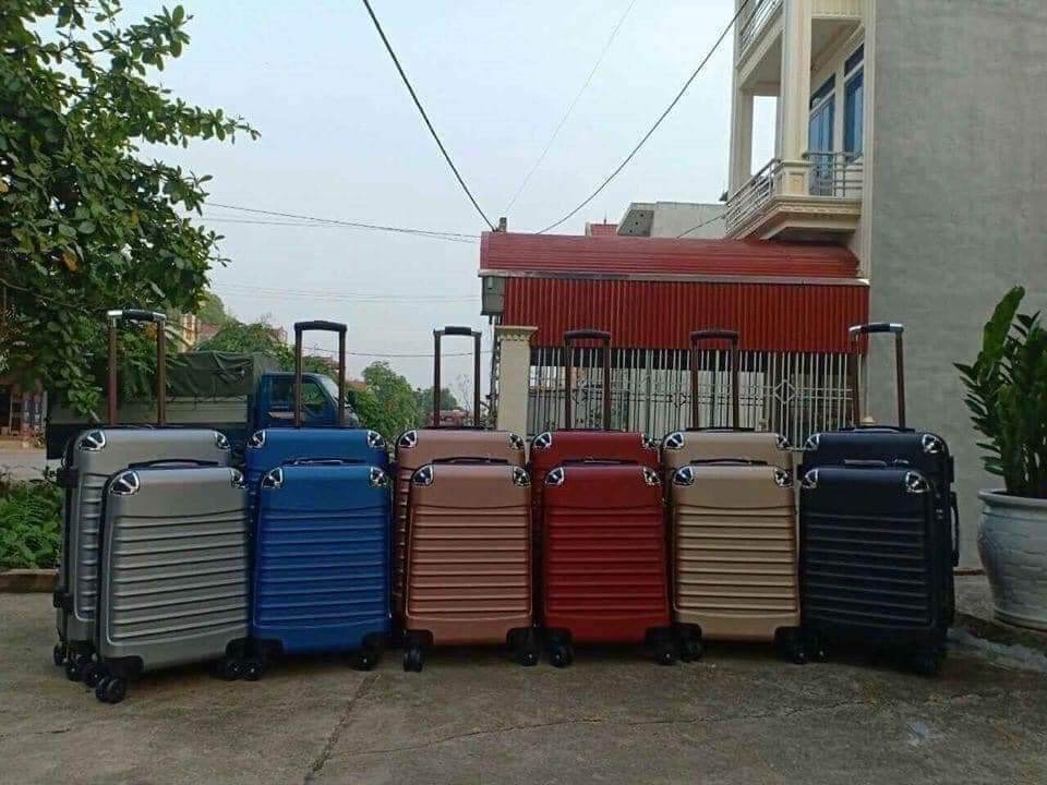 valy du lịch tay kéo có bánh xe