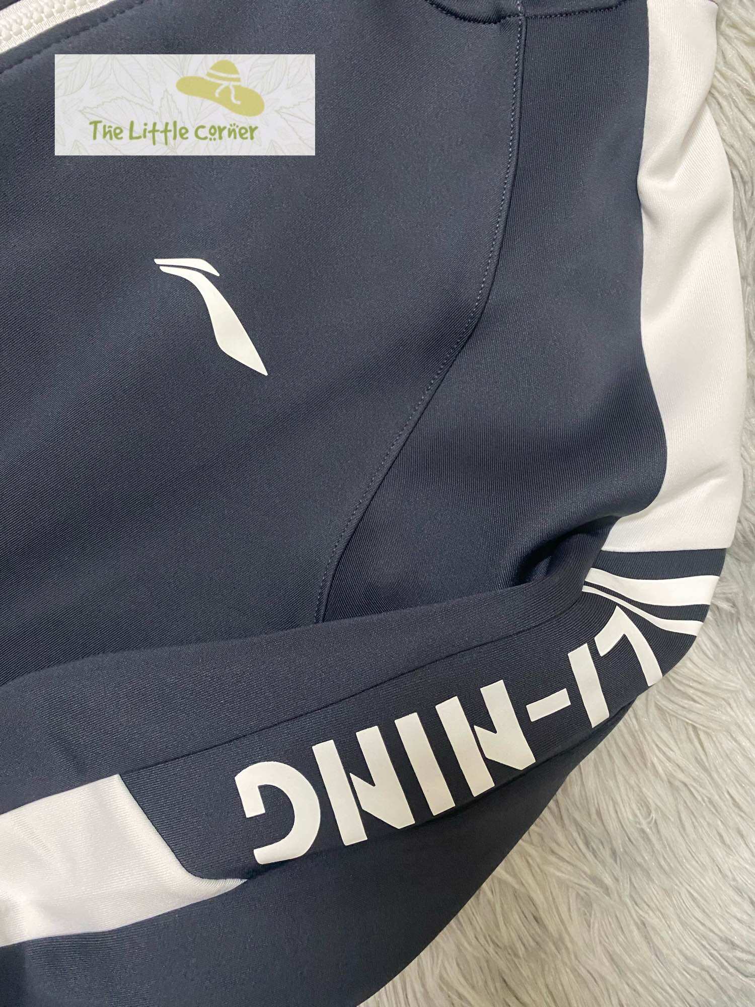 Áo khoác nỉ trơn nữ Lining AWDRB04