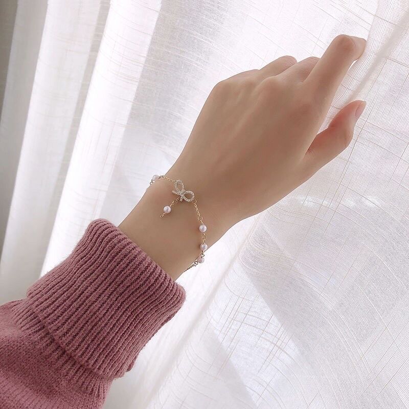 Vòng tay chuỗi ngọc đính nơ tiểu thư