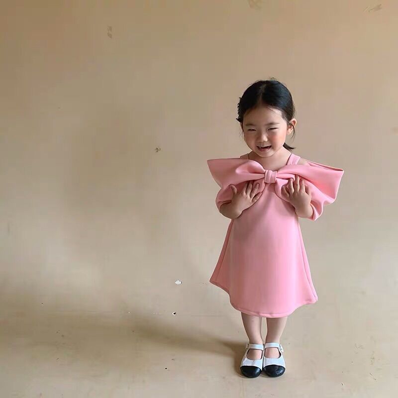 Váy hồng nơ bản to cho bé gái