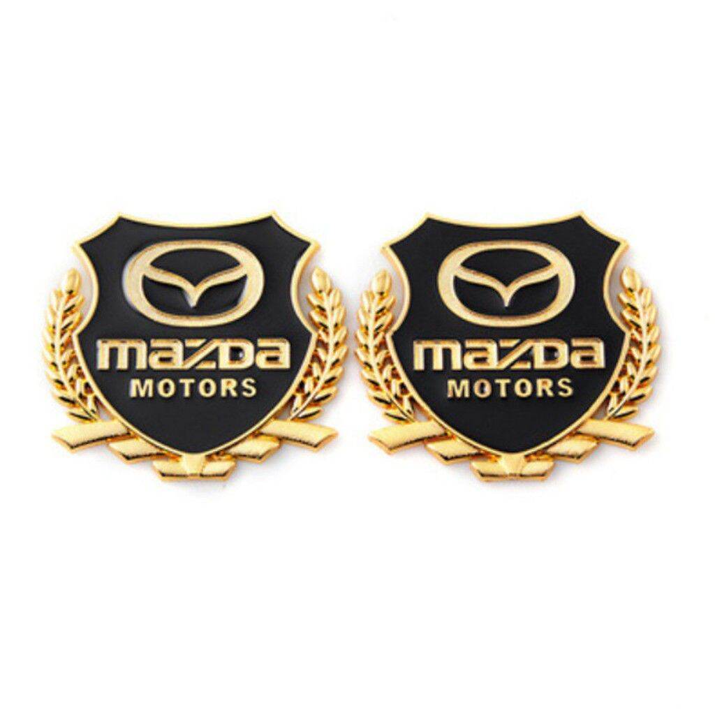 logo bông lúa chất liệu hợp kim đồng hãng xe MAZDA