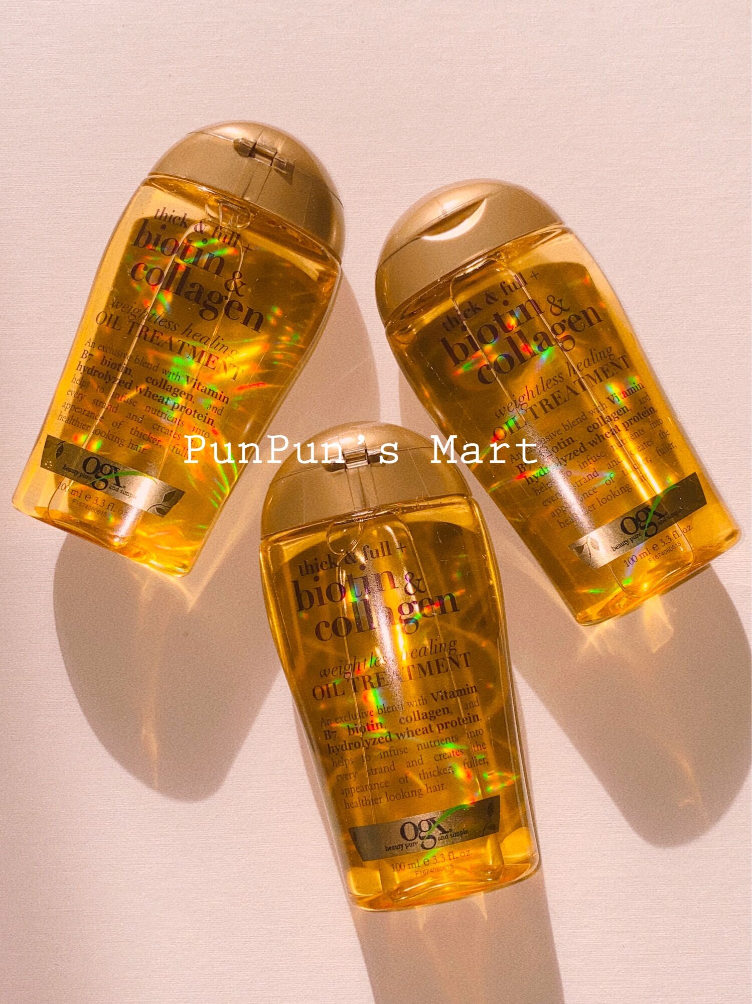 Dầu Dưỡng Tóc OGX Biotin & Collagen Weightless Healing Oil Treatment