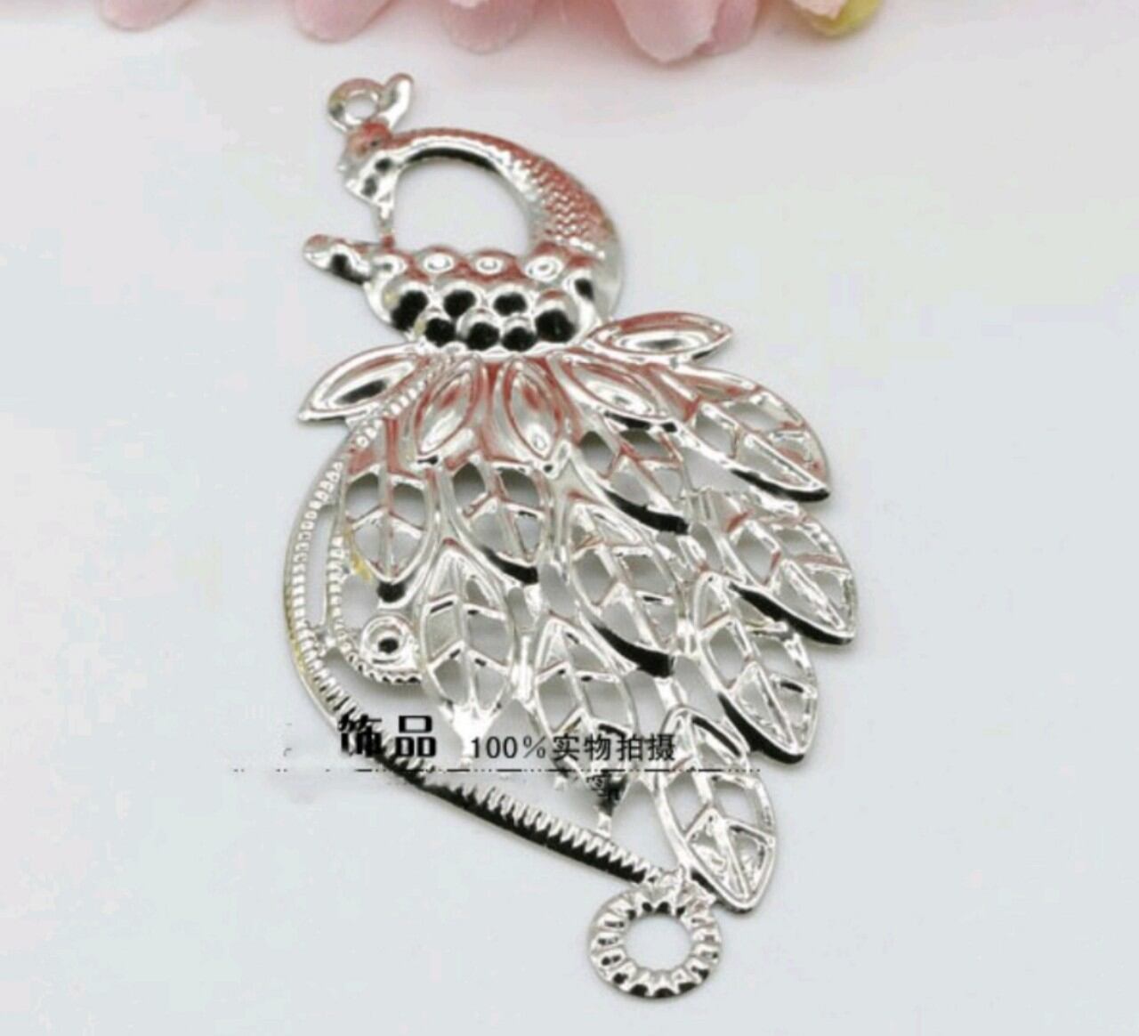 miếng kim loại hình chim công mã 19