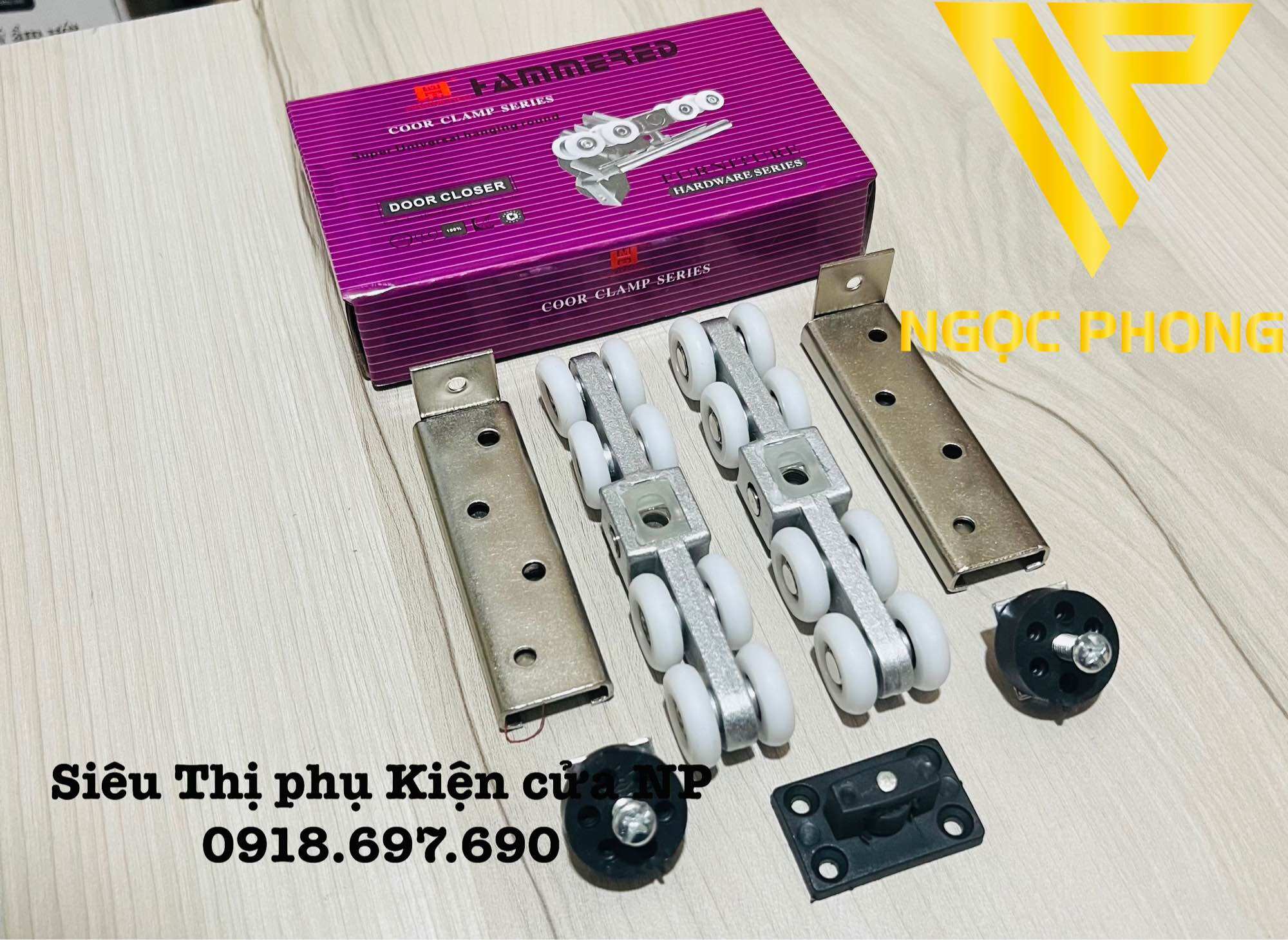 Bộ bánh xe treo cửa lùa nhôm - sắt -gỗ hộp tím