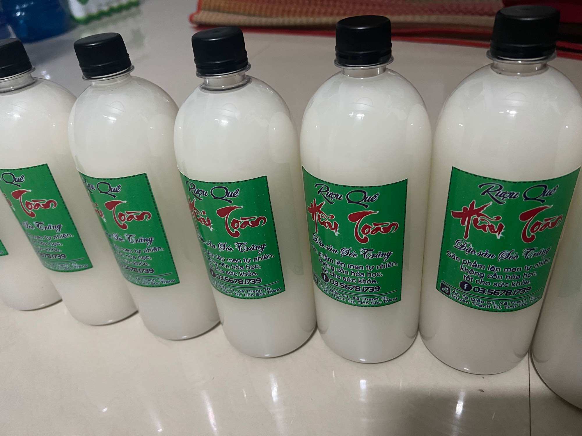 Rượu nếp sữa nhà làm, chai 1 lít 50k